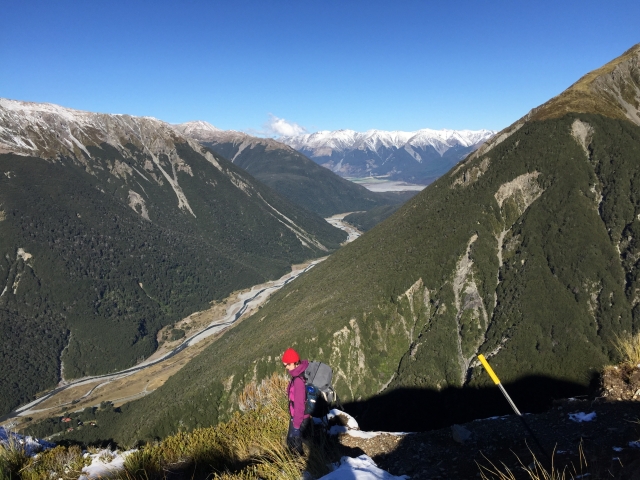 Andy descending from Avalanche Peak, Otira valley below and the Waimakariri valley out in the distance